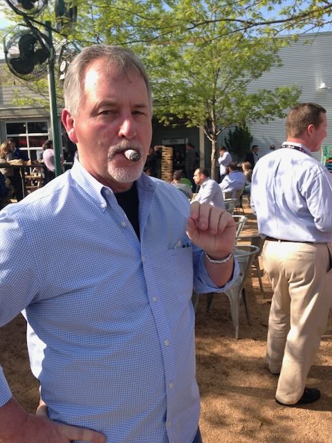 A guest enjoying a cigar outdoors