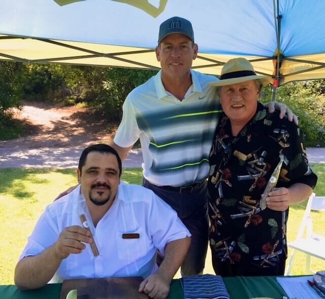 Joe and Jorge with guests at an outdoor event