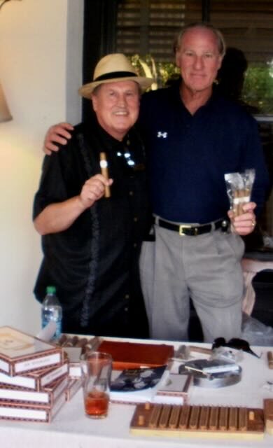 Joe with a guest at an evening party