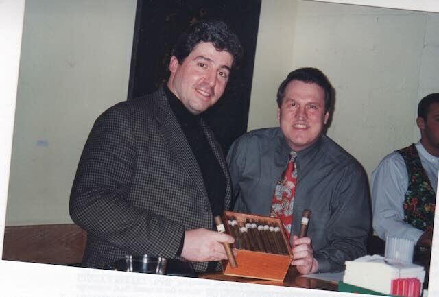 Joe with a guest at a car show cigar table