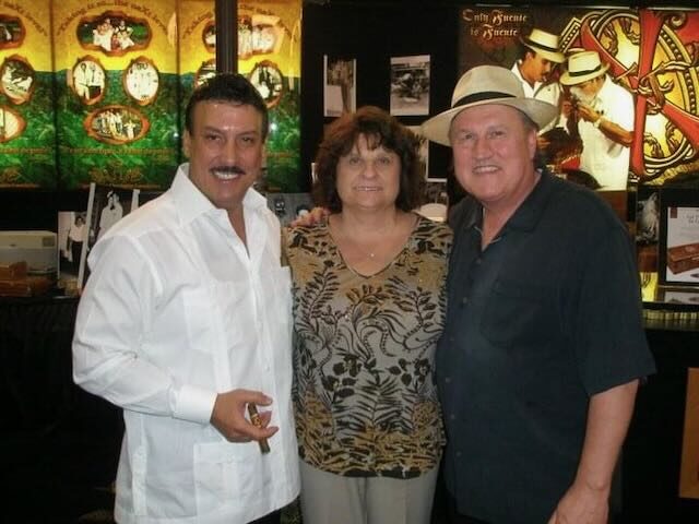 Joe, Elaine, and a guest at a trade show
