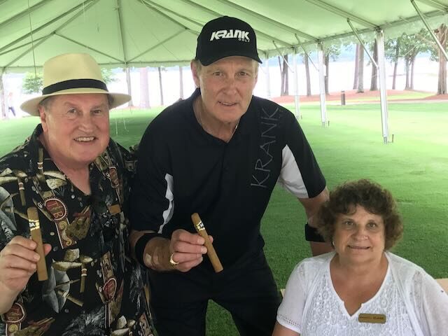 Elaine rolling cigars with Joe and a club member