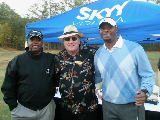 Jorge and Joe with a group of golfers at the cigar table
