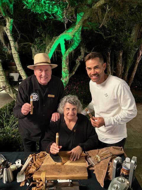 Joe with guests at a coastal club event