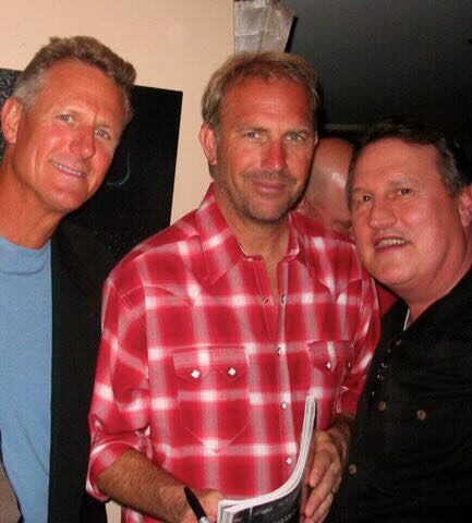 Joe with two guests at a private celebration
